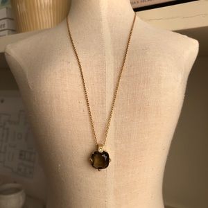 Gold necklace with gemstone